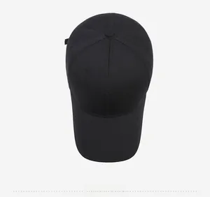 Top macro view of the black cotton baseball cap showing 6-panel structure and button