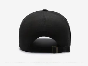 Detail view of the vintage washed black baseball cap with an adjustable metal buckle back