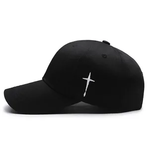 Classic black baseball cap with white cross embroidery and curved brim in side view