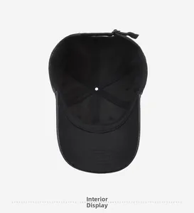 Detailed inside view of black baseball cap showing cotton lining and metal buckle