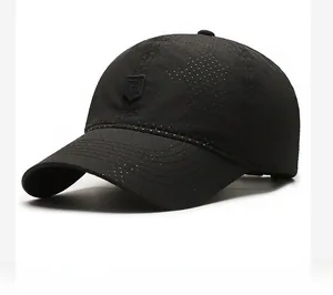 Close-up of black breathable mesh baseball cap with laser-cut holes and shield logo
