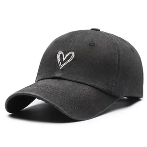 Vintage washed cotton baseball cap in charcoal black with white heart embroidery design