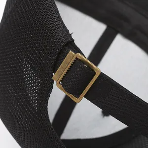 Mesh baseball cap detail featuring adjustable gold metal buckle and breathable fabric