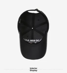 Interior display of black 100% cotton baseball cap showing lining and adjustable buckle