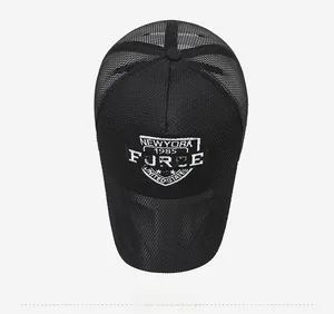 Top view detail of a black mesh baseball cap featuring vintage white embroidery logo