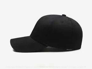 Side view detail of a classic black 6-panel composite fabric baseball cap with curved brim