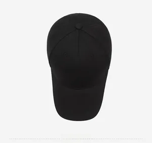 Top view of a plain black six-panel baseball cap with premium cotton twill texture