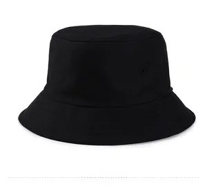 Detailed view of black cotton bucket hat showing twill fabric texture and embroidery holes