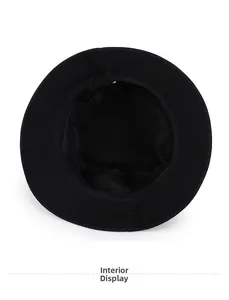 Detailed interior view of pure black cotton bucket hat showing stitching and sweatband