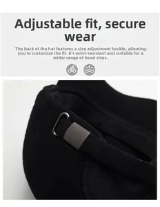 Close-up of adjustable metal buckle on black winter baseball cap for secure fit