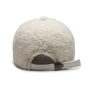 White teddy fleece baseball cap with adjustable suede strap and metal buckle, back view