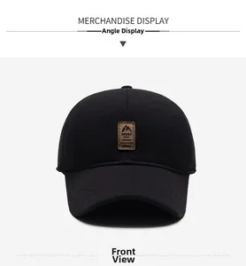 Front view of black outdoor baseball cap with brown leather sport mountain patch