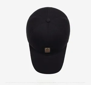 Top view of a black winter baseball cap with plush lining and sport mountain leather patch