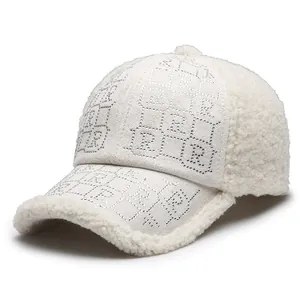 Women's warm winter baseball cap in beige faux lamb wool with rhinestone R pattern