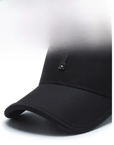 Detail of classic black baseball cap with rigid brim and leather strap with metal studs