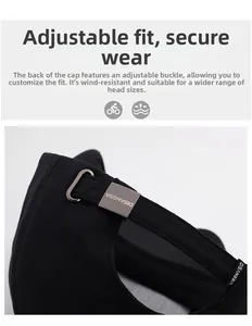 Detail of adjustable metal buckle and embroidered leather strap on black baseball cap