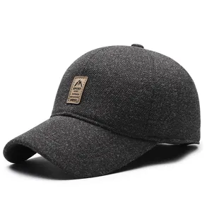 Winter men's dark grey woolen baseball cap with ear flaps and warm fleece lining