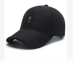 Detailed side view of black cotton twill baseball cap with decorative leather patch