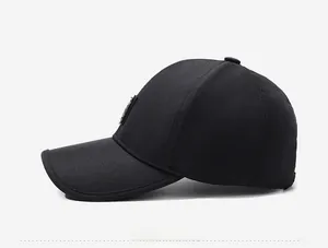 Side view of black baseball cap showing durable twill cotton fabric and shield emblem