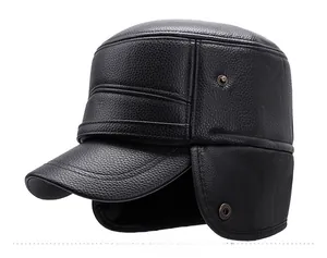 Detailed side view of black faux leather winter flat cap with ear flaps and litchi texture