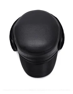 Top-down macro view of thermal winter cap showing lychee pattern leather and faux fur earflaps