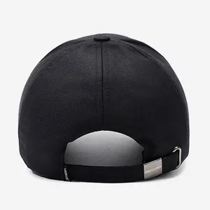 Rear view of black cotton baseball cap with adjustable metal strap and branded buckle