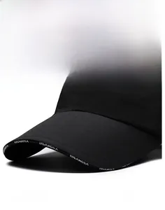 Macro detail of waterproof nylon baseball cap showing firm brim and brand logo