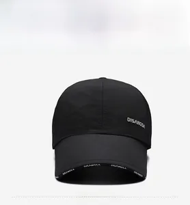 Front view of waterproof nylon baseball cap in black with lateral letter printing