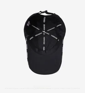 Interior view of black baseball cap with reinforced seam tape and adjustable buckle
