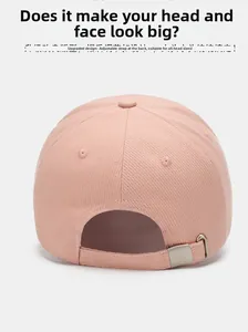 Detail of adjustable silver metal buckle on light pink baseball cap for all head sizes