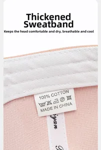 Detail of the pink baseball cap featuring a thickened cotton sweatband and quality stitching