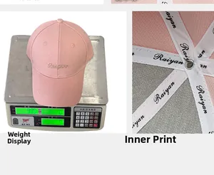 Detail of pink baseball cap showing interior brand tape and weight on digital scale