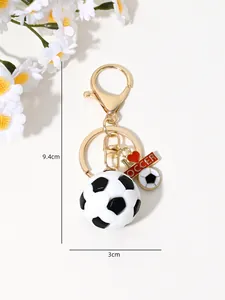 Close-up view of sports soccer keychain with 9.4cm height and 3cm width measurements