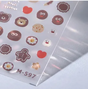 Close-up of M-597 3D embossed nail art stickers with cute bear and cookie patterns