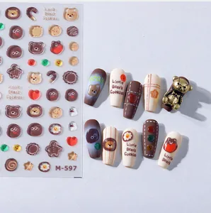Detail of cartoon bear cookie nail stickers with 3D metallic bear charms and patterns