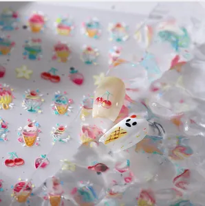 Detailed view of 3D ice cream nail stickers with embossed cherry and star patterns