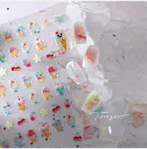 Macro detail of ice cream and fruit theme 3D nail stickers with shell gold accents