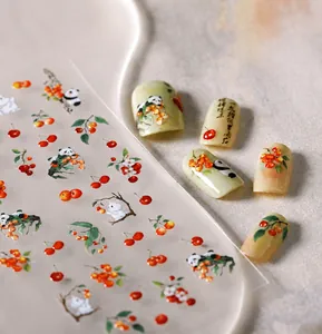 Gros plan sur stickers nail art M-564 avec pandas mignons, cerises et calligraphie