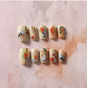 Détail de 10 patchs d'ongles panda et cerise avec calligraphie chinoise artistique