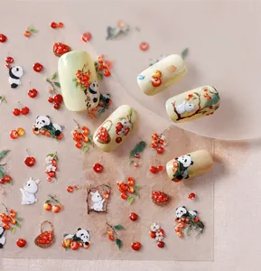 Détail macro de stickers ongles M564 avec motifs pandas, lapins et fleurs de cerisier