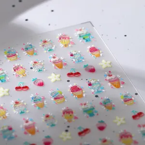 3D dessert theme nail stickers with glitter ice cream and fruit patterns on white background