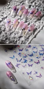 Macro detail of laser holographic butterfly nail stickers on coffin gradient nails