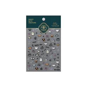 Stickers à ongles M-625 dorés au laser avec chiens mignons et nœuds sur l'emballage