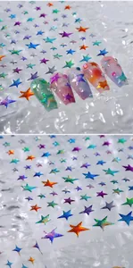 Detailed view of colorful laser star nail art stickers with vibrant holographic effects