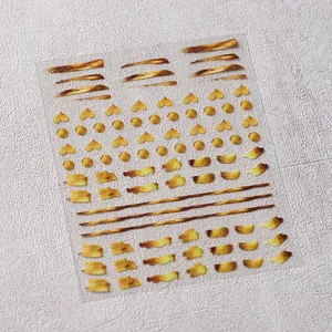 Minimalist gold metallic nail art stickers with heart and line decals on clear film