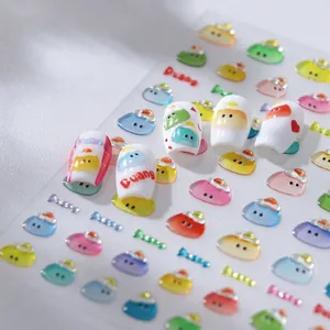 Macro view of cute cartoon 3D nail art stickers with colorful jelly-like face patterns