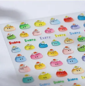 Macro shot of 3D colorful jelly nail stickers with Duang text and cute cartoon faces