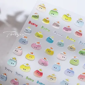 Macro shot of 3D macaron cartoon nail stickers with colorful glossy letters and textures