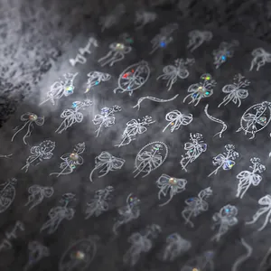 3D white embossed bow and rose nail art stickers with iridescent pearls and lace details