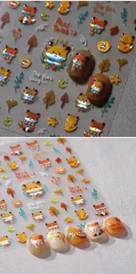 Close-up of holographic autumn forest nail stickers with 3D laser fox and maple leaf motifs
